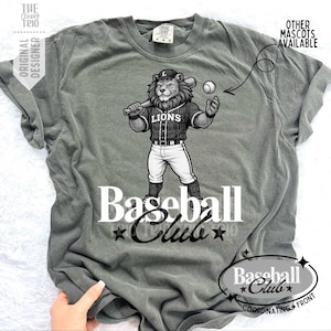 May include: A white ceramic mug with a black handle and the text "But First, Coffee" in a black, handwritten-style font. The mug is on a white surface.