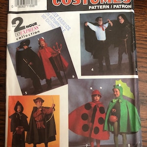 May include: Simplicity pattern 7470 for children's costumes. The pattern includes eight different costumes: a vampire, a devil, a Robin Hood, a ladybug, a frog, a witch, a knight, and a ghost. The pattern is for sizes small to large.