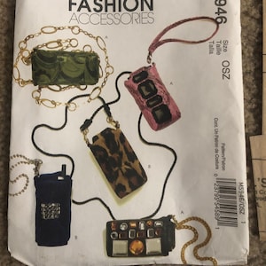 May include: McCall's Fashion Accessories pattern envelope featuring illustrations of various small bags and pouches. Designs include a green quilted bag with a gold chain, a pink snakeskin-patterned pouch, and a leopard print case.