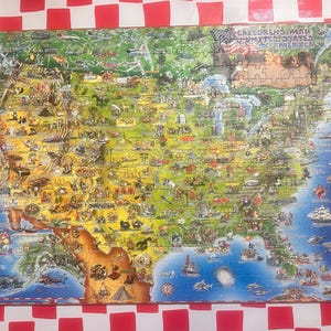 May include: A colorful jigsaw puzzle depicting a map of the United States with illustrations of landmarks and animals. The puzzle is titled "Children's Map of the United States of America".