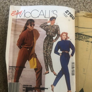 May include: A sewing pattern for a jumpsuit with three different styles. The pattern is for sizes 10 and includes instructions for a focus on overlock stitching. The pattern is from McCall's Easy.