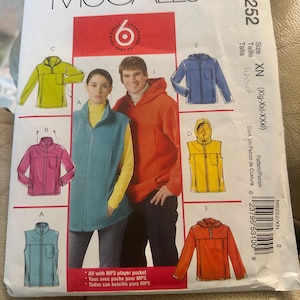 May include: A sewing pattern for a hooded jacket, vest, and pullover. The pattern includes instructions for making a jacket with a zipper closure, a vest with a zipper closure, and a pullover with a zipper closure. The pattern is for sizes XN (XIg-Xxl-XXXI).
