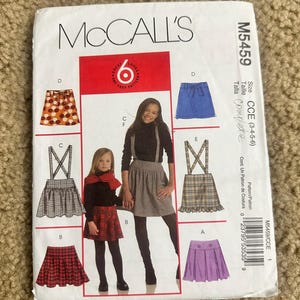 May include: McCall's M5459 sewing pattern for girls' skirts. The pattern includes various skirt styles, with images of the finished garments. The package features the McCall's logo and size information for sizes 3-4-5-6.