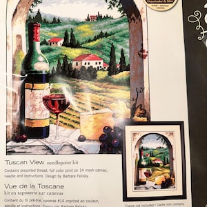 May include: Tuscan View needlepoint kit featuring a detailed scene of a wine bottle, glass, and cheese in front of a Tuscan landscape. The kit includes pre-sorted thread, a full-color print on 14 mesh canvas, needle, and instructions. Design by Barbara Felisky.