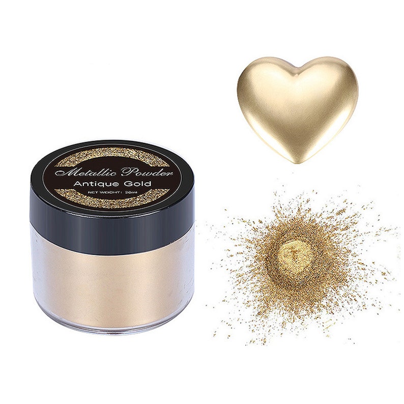 May include: A small jar of metallic gold powder labeled "Metallic Powder Antique Gold" with a net weight of 20ml. The powder is shown in a heart shape and as a small pile.