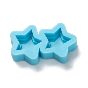 May include: Two blue silicone star-shaped moulds for making crafts or resin projects.
