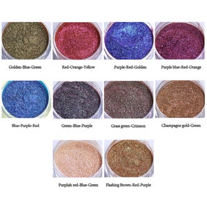 May include: Ten small jars of iridescent glitter, each with a different color combination. The colors include golden, blue, green, red, purple, orange, yellow, and brown.