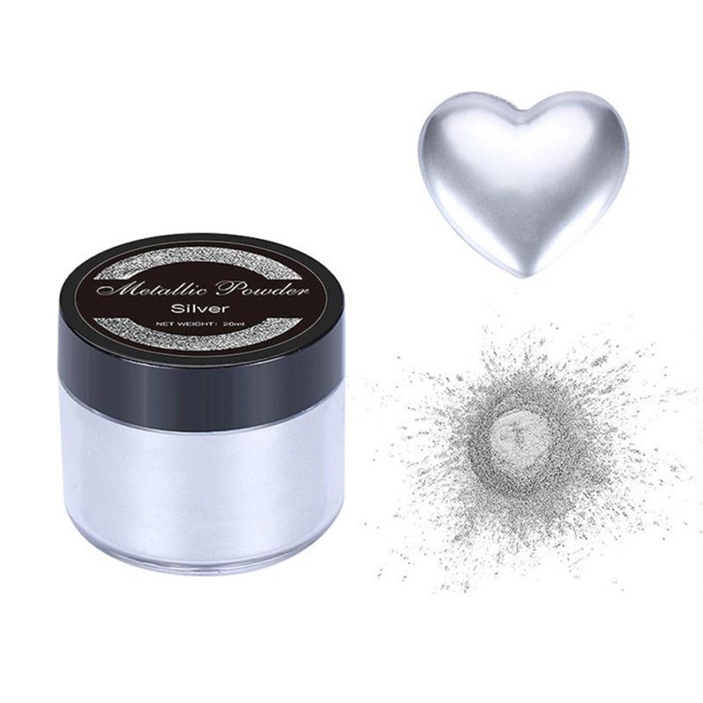May include: A jar of silver metallic powder with a black lid and label that reads "Metallic Powder Silver Net Weight: 20ml". The powder is shown spilling out of the jar in a heart shape.