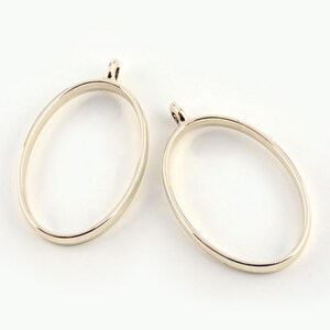 10 st smyckeshängen med öppen baksida, oval resinbezel