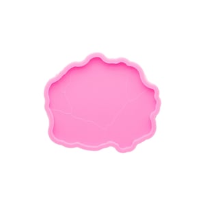 May include: A bright pink, irregularly shaped silicone mold with a wavy edge. The mold has subtle vein-like details across its surface, suggesting a natural stone or geode design. Ideal for resin art or crafting projects.
