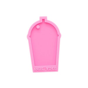 May include: Pink silicone mold shaped like a cup with a round hole at the top. The mold has the text "ANGEL WINGS" at the bottom.