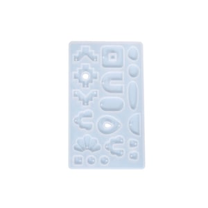 May include: A clear silicone mould with 18 different shapes for making jewellery or other crafts. The shapes include geometric, organic, and abstract designs.