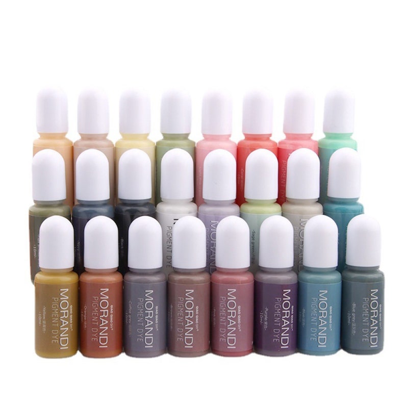 May include: A set of 20 small bottles of pigment dye in various muted colors. The bottles are labeled "MORANDI PIGMENT DYE" and have white caps.