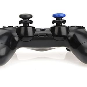 May include: A black PlayStation 4 controller with blue and black thumbstick caps.