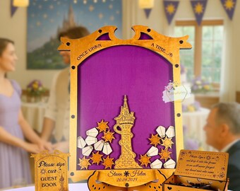 May include: Wooden guest book set with a purple backdrop featuring a tower and sun cutouts. The frame reads "ONCE UPON A TIME..." and includes a sign that says "Please sign our GUEST BOOK". A box is included with the text "Please sign a..."