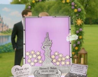 May include: A wooden wedding guest book alternative with a purple background, a silver tower, and wooden sun-shaped accents. Includes a heart-shaped sign that says "Please sign Our GUEST BOOK". The date "09.09.2025" is engraved.