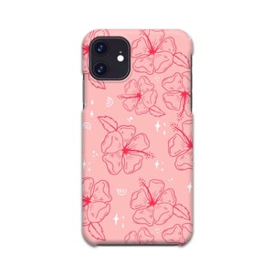 May include: A pink phone case with a floral pattern. The flowers are red and white and have a delicate, hand-drawn style. The background is a light pink color.