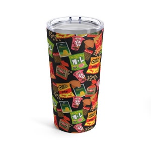 May include: A stainless steel tumbler with a black background and a repeating pattern of various snack foods, including chips, crackers, and candy. The snacks are in various colors, including red, yellow, green, and blue.