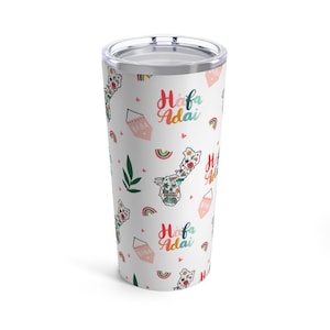 May include: White stainless steel tumbler with a colorful pattern of rainbows, hearts, and the text "Hafa Adai" and "Biba".