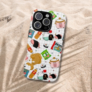 May include: A white smartphone case featuring a grid pattern background with colorful illustrations of Japanese food items including pink rice cookers, sushi rolls, soy sauce bottles, ramen noodle packets, and a large golden koi fish graphic.