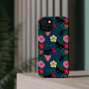 May include: A teal blue phone case with a floral and butterfly pattern. The flowers are pink, red, yellow, and white. The butterflies are black with white accents.
