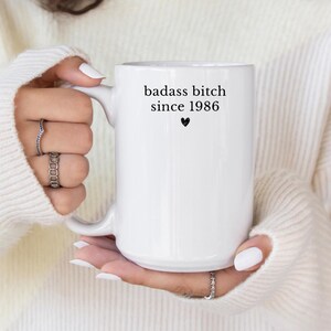 May include: A set of three ceramic mugs with a speckled, matte finish. The mugs are in shades of cream, light gray, and dark gray. Each mug has a simple, minimalist design, perfect for coffee or tea.