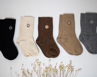 Smily socks in different colors and sizes. Stockings children's socks