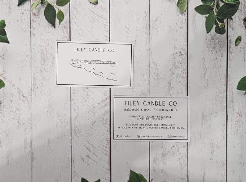 May include: Two white cards with black text and a simple line drawing of a coastline. The top card reads "Filey Candle Co." The bottom card reads "Filey Candle Co. Handmade & Hand Poured in Filey. Made from Quality Fragrance & Natural Soy Wax. Take home our unique Filey fragrances. Explore our hand poured candles & diffusers. www.fileycandles.co.uk @fileycandles"