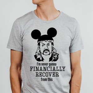 May include: A gray t-shirt with a black and white image of a man with a mustache and long blonde hair wearing a pair of Mickey Mouse ears. The text on the shirt reads "I'm never gonna financially recover from this."