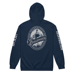 May include: Navy blue hooded sweatshirt with the text "International Brotherhood of Boilermakers" and a logo of a worker holding a tool. The sleeves have the text "Boilermakers" printed on them.