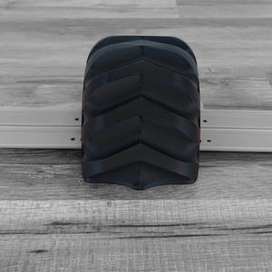 Peut inclure: Un objet g&eacute;om&eacute;trique noir avec un motif en chevrons. L'objet est rectangulaire avec des bords arrondis et semble &ecirc;tre fait d'un mat&eacute;riau solide. Le design pr&eacute;sente une s&eacute;rie de rainures en forme de V sur sa surface.