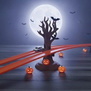 May include: A Halloween-themed scene featuring a toy car on an orange track, a spooky tree, and glowing jack-o'-lanterns. A full moon and bats complete the eerie atmosphere. The scene evokes a sense of fun and fright.