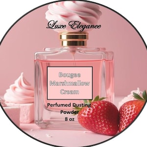 May include: A pink perfume bottle with a gold cap and a pink, flower-shaped top. The bottle has a label that reads "Bougee Marshmallow Cream Perfumed Dusting Powder 8 oz." Two red strawberries are in front of the bottle.