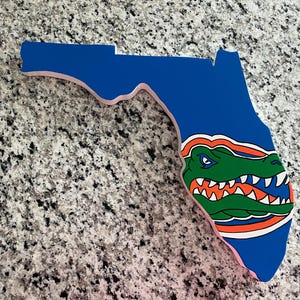 Florida Gators handpainted - wooden sign in the shape of Florida cut out wall sign- Handpainted , comes with hook for hanging.