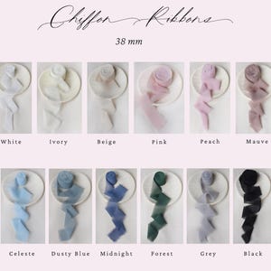May include: Assortment of 38 mm wide chiffon ribbons in various colors, including white, ivory, beige, pink, peach, mauve, celeste, dusty blue, midnight, forest, grey, and black. The ribbons are displayed on white plates.