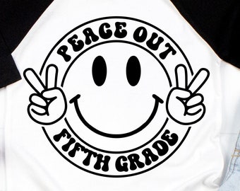 May include: A white t-shirt with black sleeves and a black and white peace sign graphic that says "Peace Out Fifth Grade".