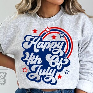 May include: Gray sweatshirt with a blue and red graphic that says "Happy 4th of July" with stars and red, white, and blue stripes.