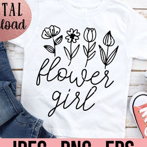 May include: A white t-shirt with a black design of stylized flowers and the text "flower girl".