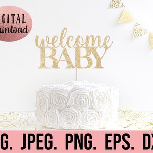 May include: Gold glitter cake topper with the text "welcome baby" on a white cake with white frosting.