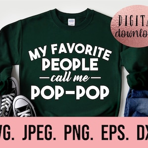 May include: A dark green sweatshirt with white text that reads "My Favorite People - call me - Pop-Pop". The sweatshirt is on a white background with a pair of black sneakers and blue jeans.