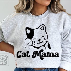 May include: A gray sweatshirt with a black and white cartoon cat and the text "Cat Mama" in a retro font.