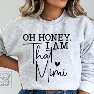 May include: Gray sweatshirt with the text "Oh honey, I am that Mimi" in black with a small black heart.