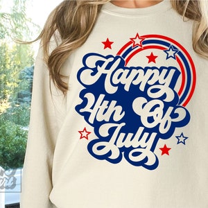 May include: A white sweatshirt with a blue and red graphic that says "Happy 4th of July" with stars around it.