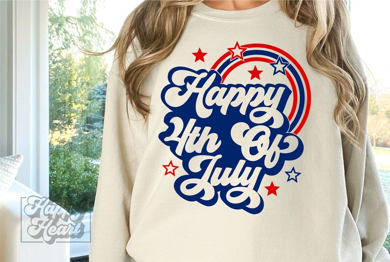 May include: A white sweatshirt with a blue and red graphic that says "Happy 4th of July" with stars around it.