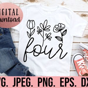 May include: A white t-shirt with black floral designs and the word "four" in a handwritten font.