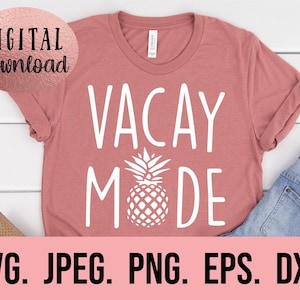 May include: A pink t-shirt with the text "VACAY MODE" in white, featuring a white pineapple graphic. The text is in a casual, handwritten font.