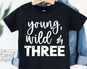 May include: Black t-shirt with white text that reads "young, wild & three".