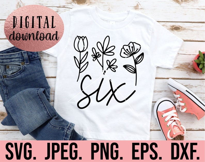 May include: A white t-shirt with a black design of the word "six" surrounded by stylized flowers. The design is perfect for a child's birthday.
