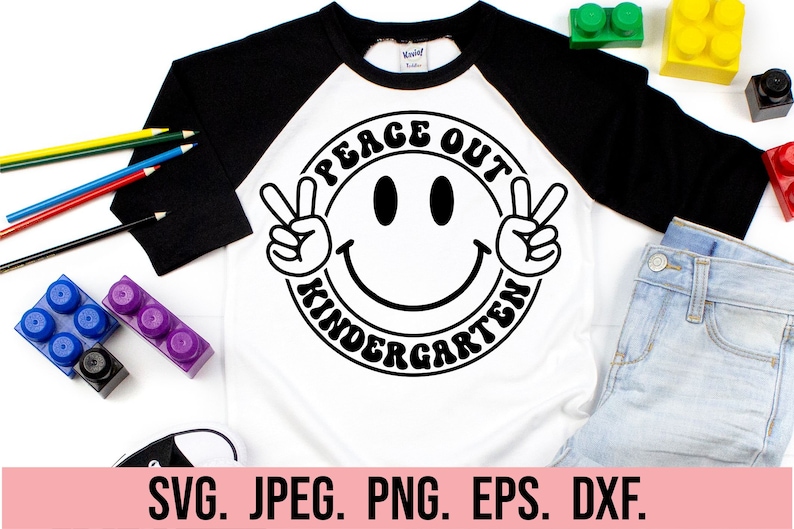 May include: A white and black t-shirt with a black and white peace sign and the text "Peace Out Kindergarten".
