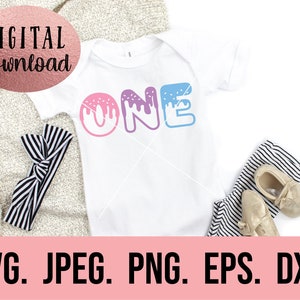 May include: A white onesie with the word "ONE" in pink, purple, and blue with white frosting and sprinkles. The onesie is on a white background with a black and white striped headband and a pair of gold shoes.